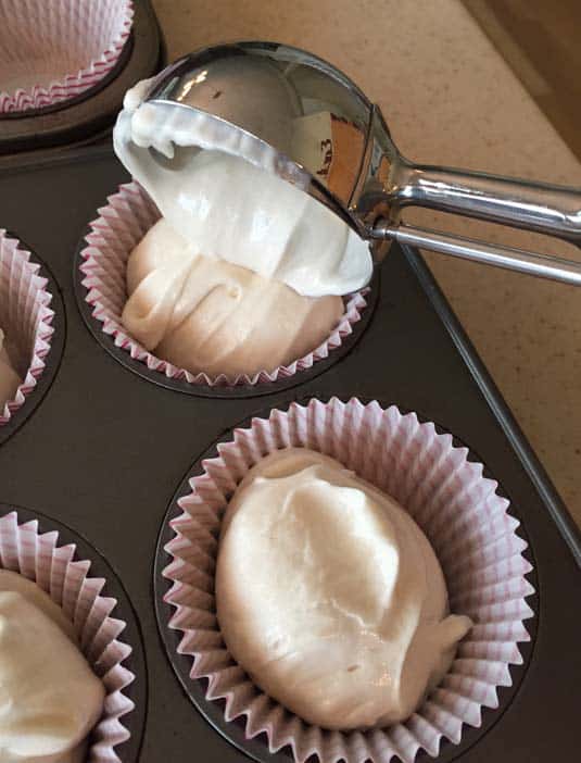 Scoop cupcake batter