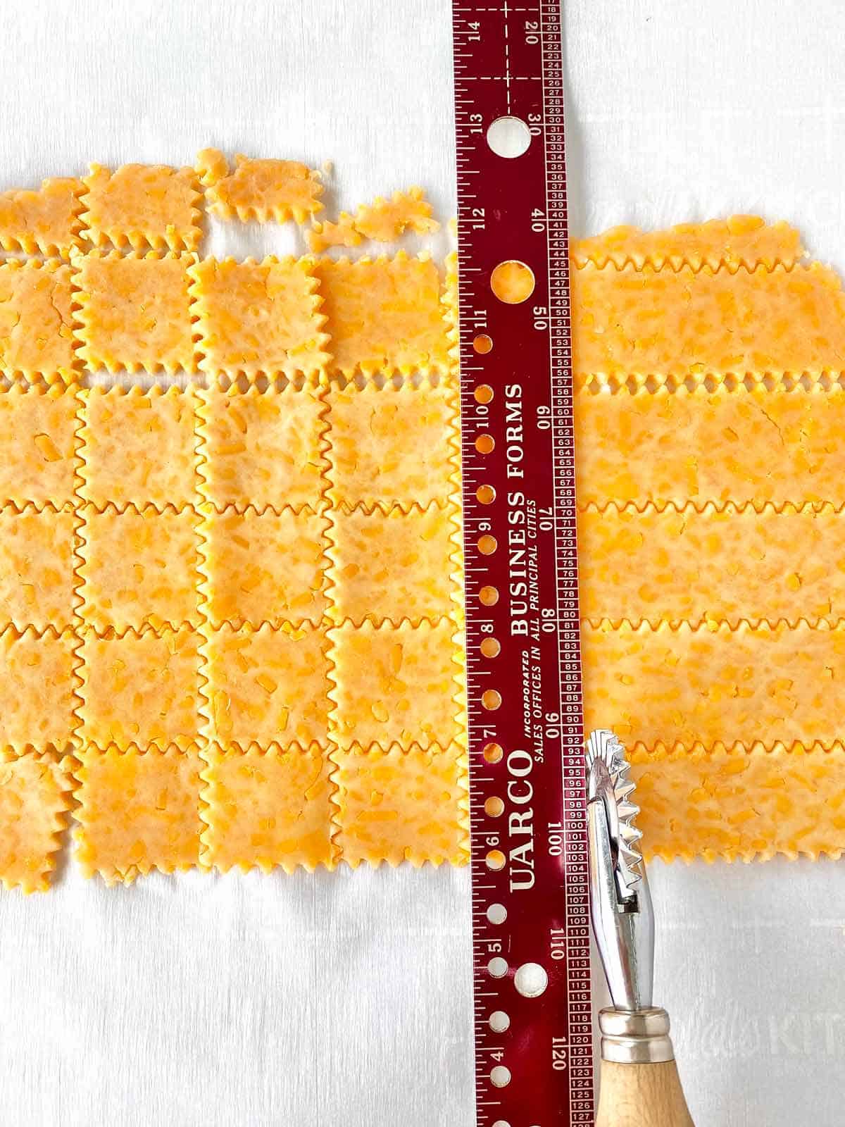 CrackersB Measuring and cutting homemade crackers in squares.