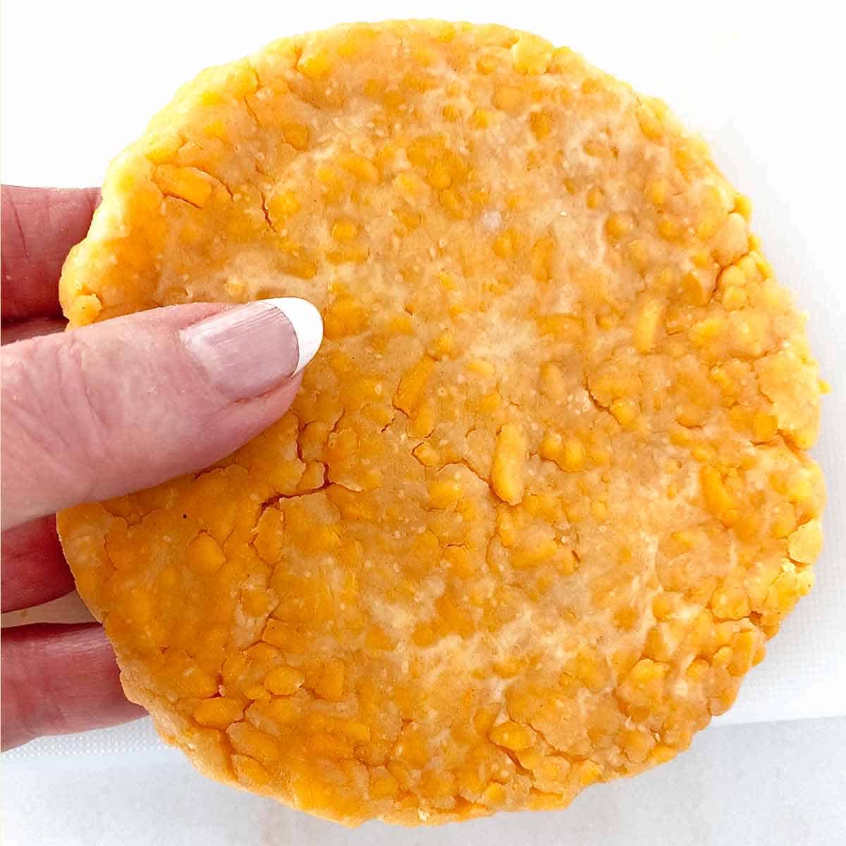 Crackers6 Close up of a disc of chilled dough to make cheese crackers.