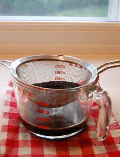 Straining out the coffee grounds.