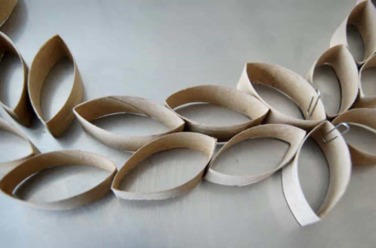 Urban-Homesteader-toilet-paper-tube-art-2 Close up of toilet paper tube pieces held together with glue and paper clips.