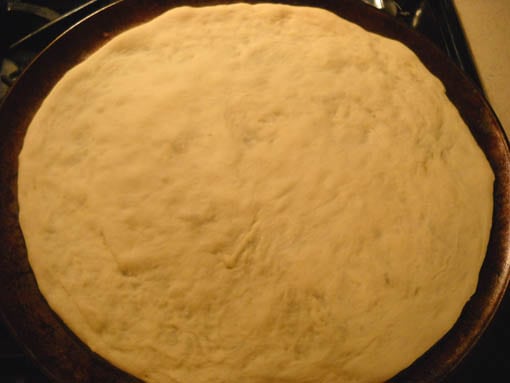 PizzaC Baking homemade pizza at Happy Simple Living