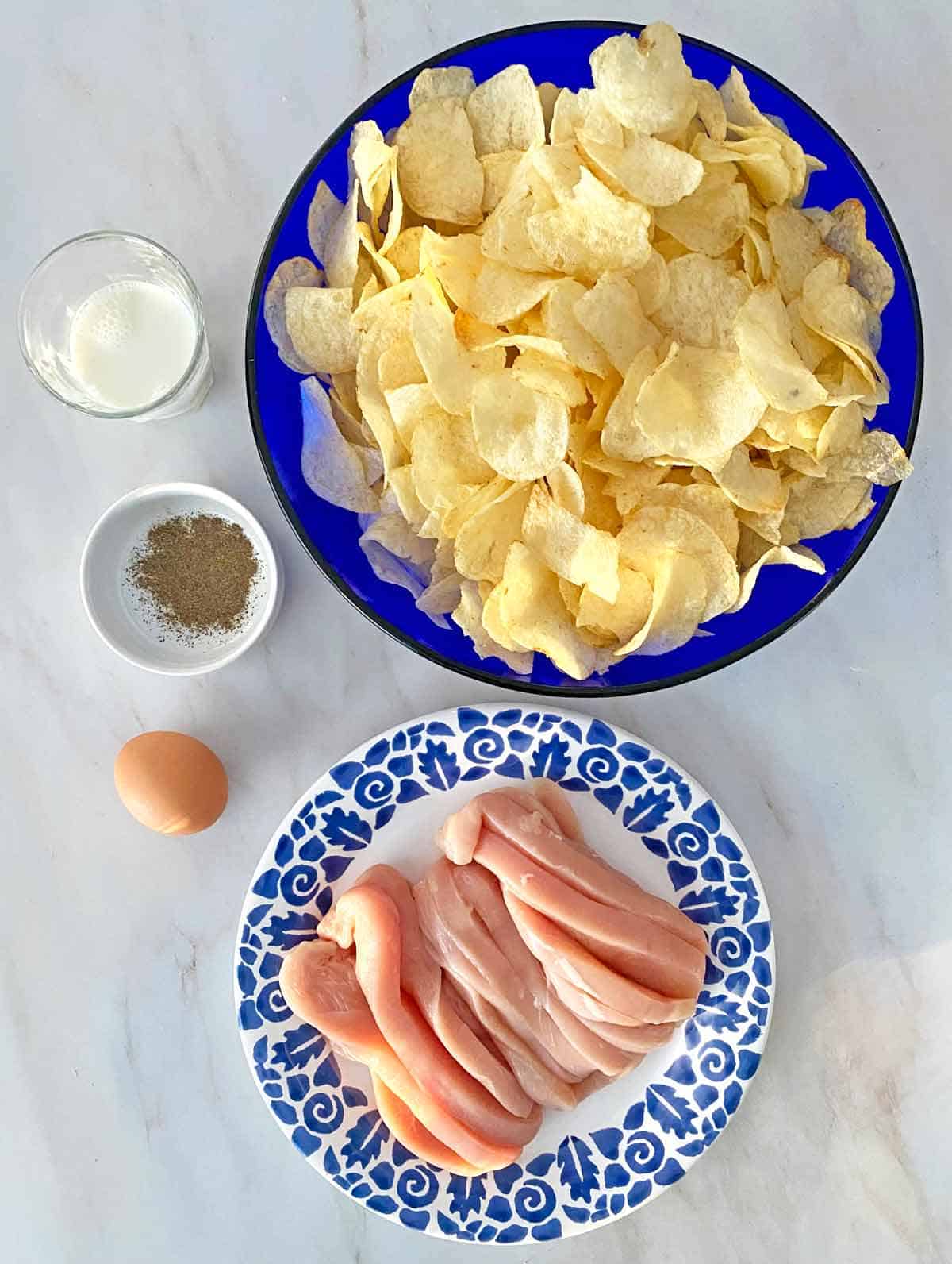Ingredients to make oven baked potato chip chicken tenders.