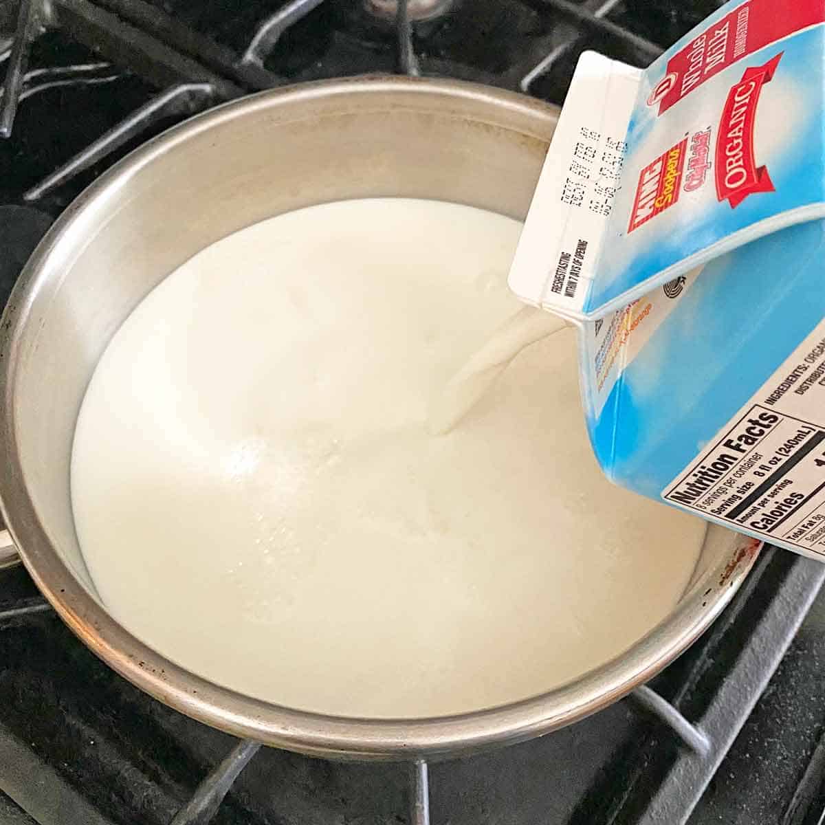 yogurt2 Pouring milk into a heavy saucepan.