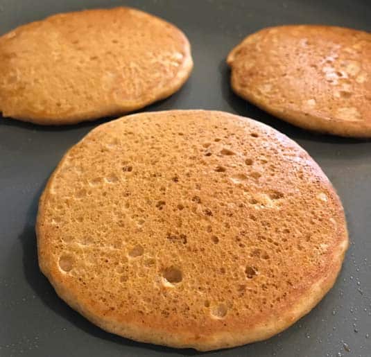 pumpkin pancakes on the griddle