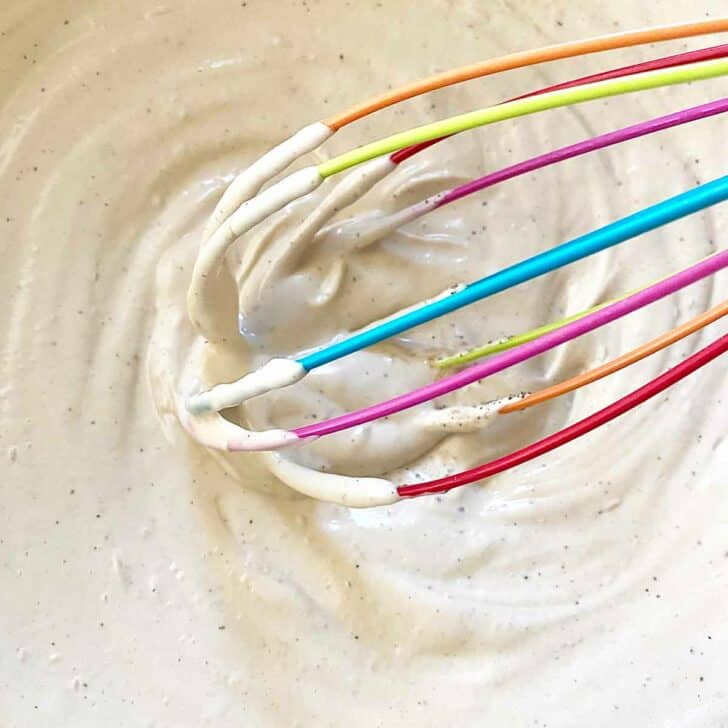 Whisking the ranch dressing, mayonnaise and seasonings.